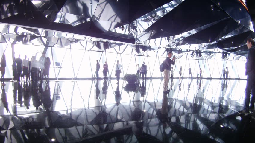 GUANGZHOU - NOV 24: (Timelapse View) Visitors walk and take photographs inside Canton television tower on November 24, 2011 in Guangzhou, Guangdong, China.