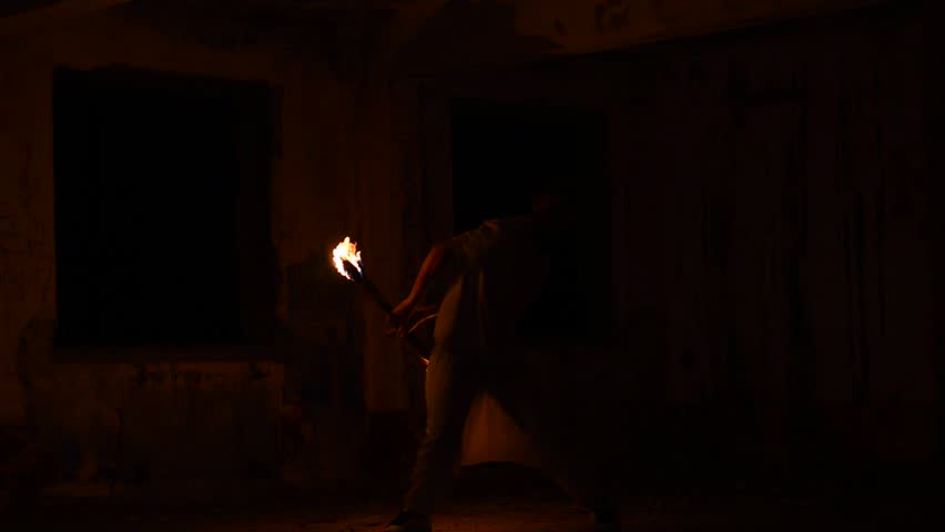 man juggling fire