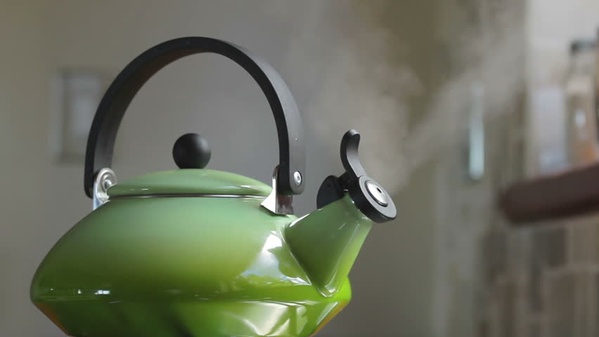 Boiling retro lime green kettle boiling with steam emitted from spout. Loop-able. Shallow DOF. Includes high quality whistling and boiling audio.
