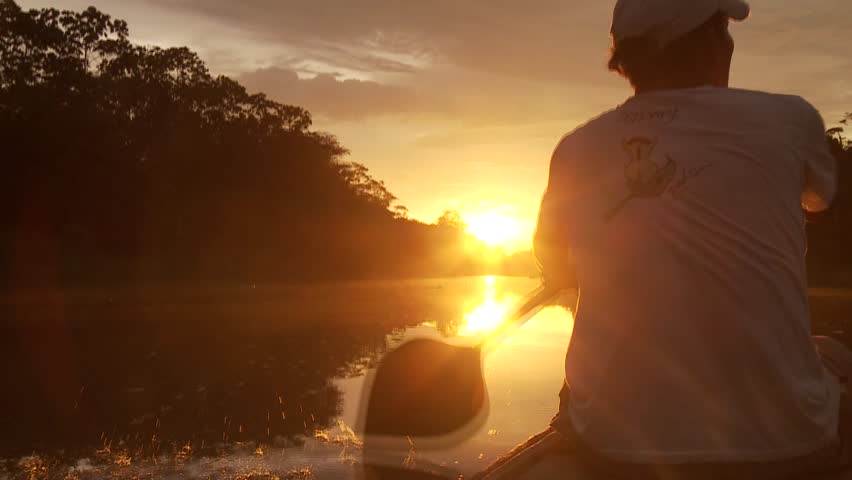 


Paddeling With Canoe On The Amazon River in front of the sunset, South America, Peru