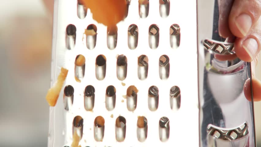 A carrot being grated
