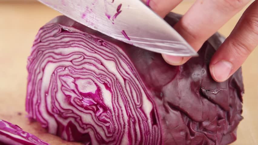 Red cabbage being sliced