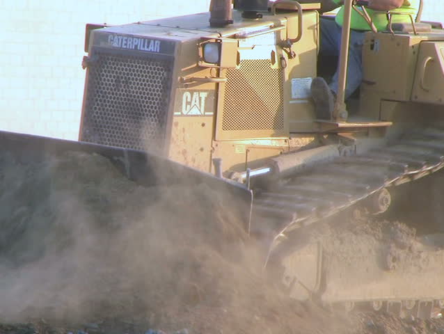 Dozer Clears Edge of Road 
