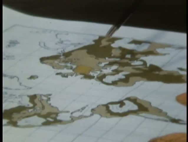 Close-up of pointer on maps