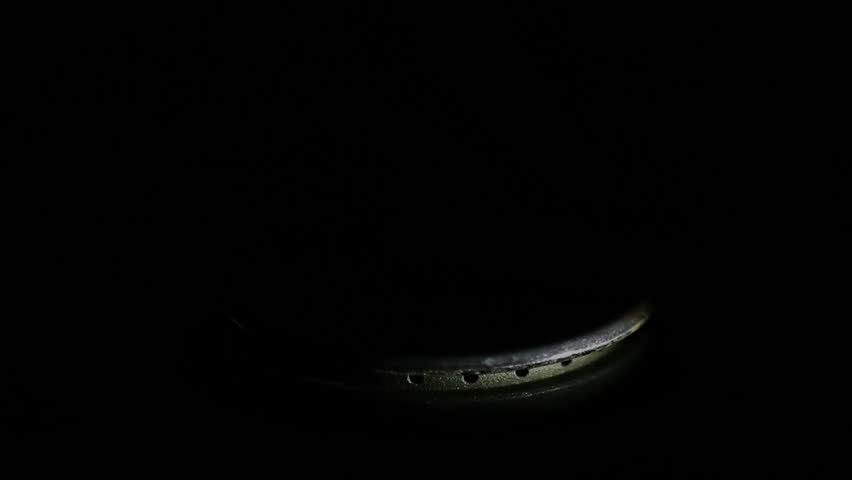 Natural gas inflammation in stove burner, close up view