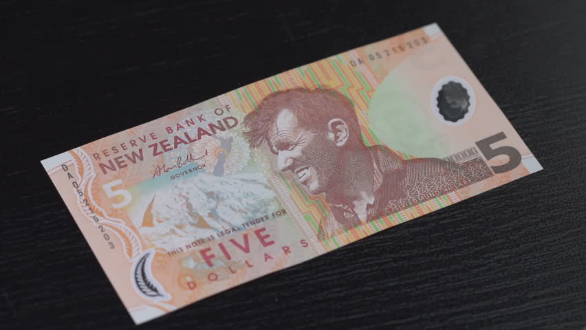 New Zealand Dollar counted on a table