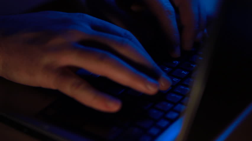 hacker typing on keyboard 4/4
