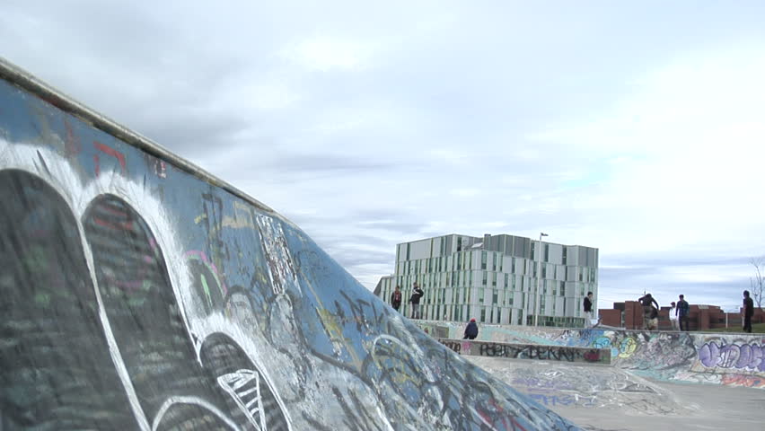 BMXer does a backflip in a skatepark
