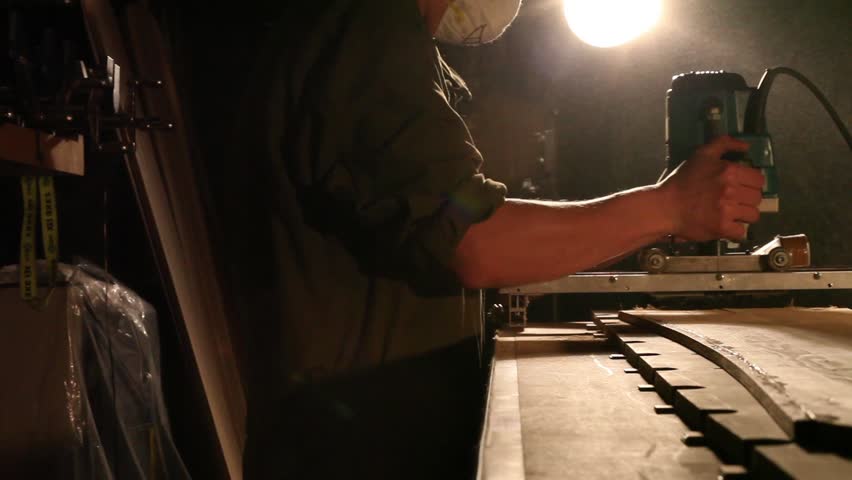 Workman in joinery workshop.