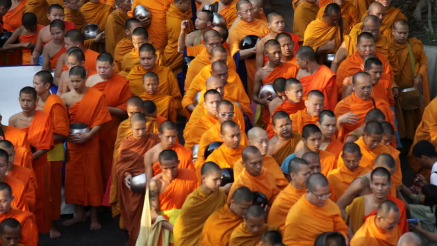 BANGKOK, MARCH 17, 2012: Monks are participating in a Mass Alms Giving of 12,600 monks for the Makha Bucha celebrations in Bangkok, Thailand on March 17, 2012. 