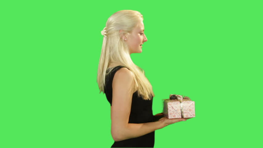 Female giving present on greenscreen 