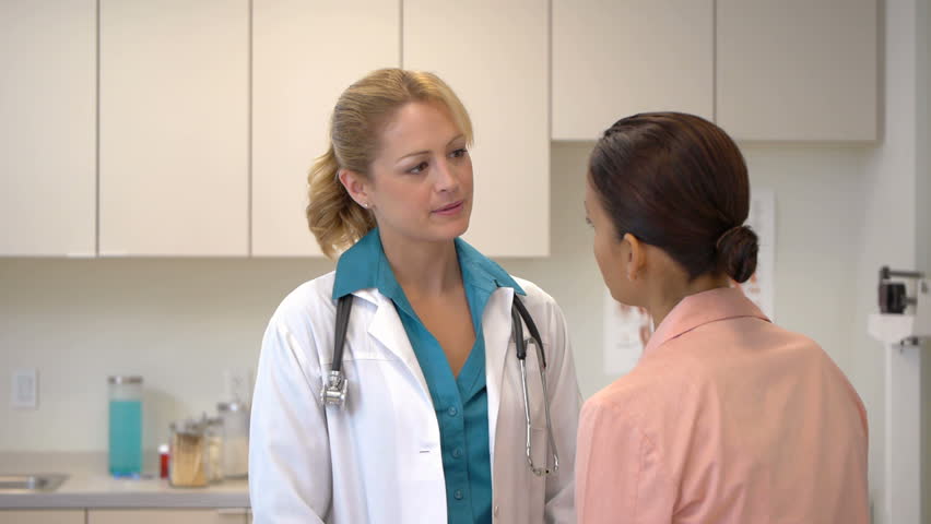 Female doctor talking with patient