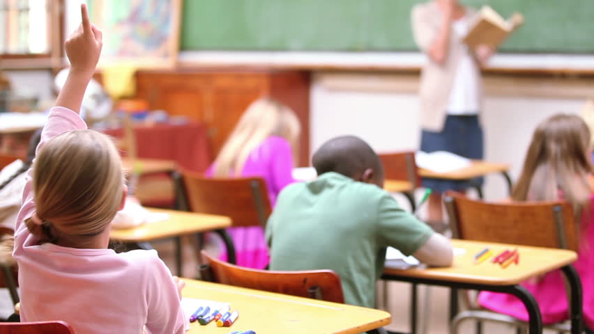 Pupil raising her finger in the classroom