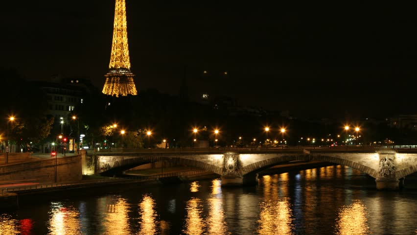 Paris - Circa 2010: The Eiffel Tower in 2010. Timelapse tilt up of Eiffel Tower with Seine River, Paris, France.