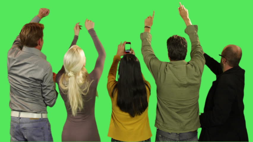 Crowd cheering and taking picture on green screen
