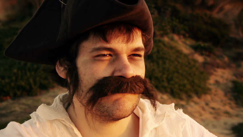 Sailor Searching With Spyglass (HD). Pirate sailor with white shirt looking at the horizon with a spyglass at sunset close up. He later nods head in disappointment.