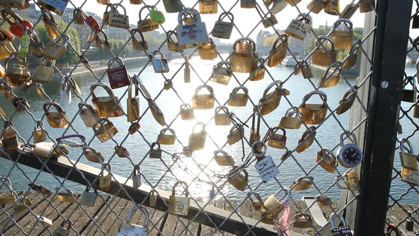 PARIS, FRANCE APRIL 8th: Padlocks on Pont des Arts, Paris on April 8th, 2012. The bridge is a favourite spot for couples who attach a padlock to the railing and throw the key into the river.