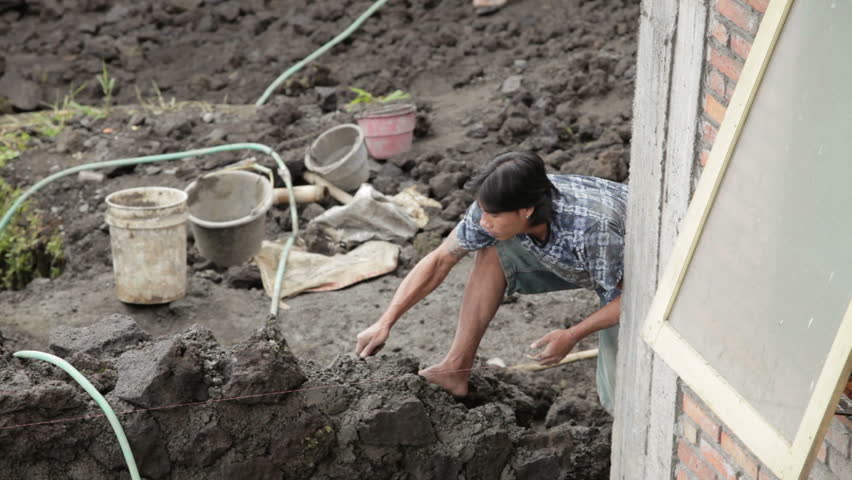 BALI - JANUARY 22: Construction labour in Kintamani in Bali on January 22, 2012 in Bali, Indonesia. Bali is seeing an exponential increase in its property development.