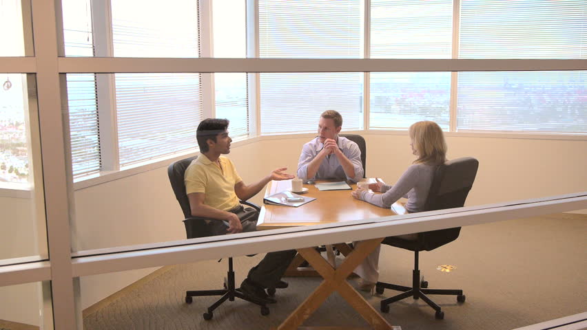 Group of coworkers at small conference table