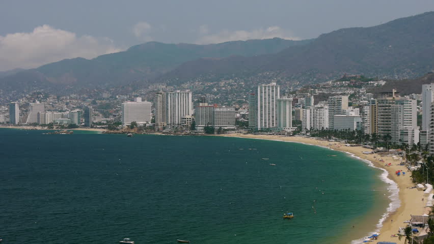 Acapulco Bay With Buildings (HD). Acapulco bay shot. All logos and info from beach and buildings carefully cloned out and removed. 