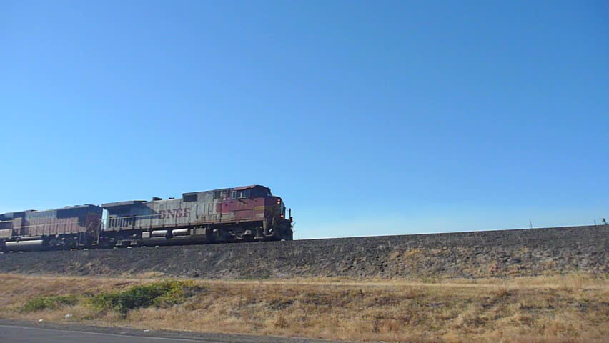VANCOUVER, WASHINGTON - CIRCA JANUARY 2012: Train passes by on high railroad tracks.