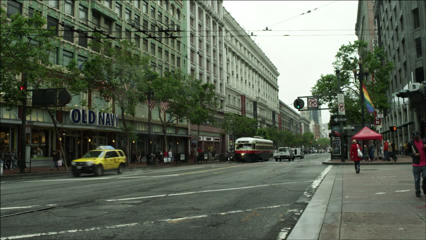 SAN FRANCISCO - CIRCA OCTOBER 2011: Market Street busses passes Historic Trolley circa October 2011 in San Francisco, CA.