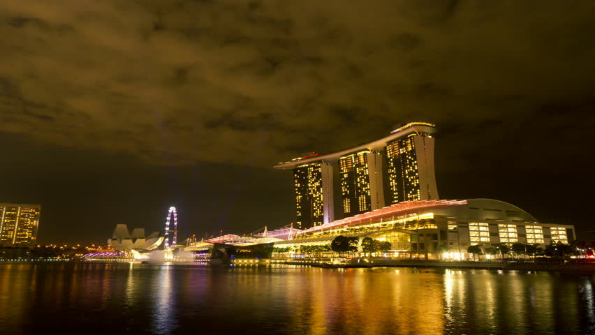 SINGAPORE - JUNE 1: Time lapse of light show at Marina Bay Sands on June 1, 2012 in Singapore. Marina Bay Sands is a luxury hotel integrated with shopping mall and casino, developed by Las Vegas Sands. 