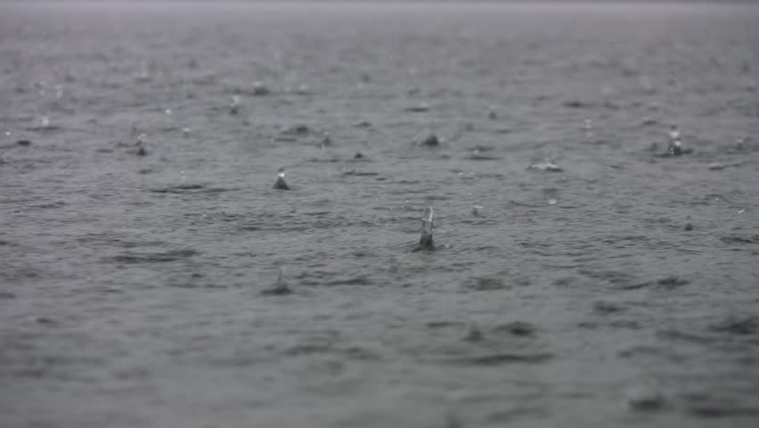 A heavy rain pounds the lake surface. Great rain noises including a roll of thunder!