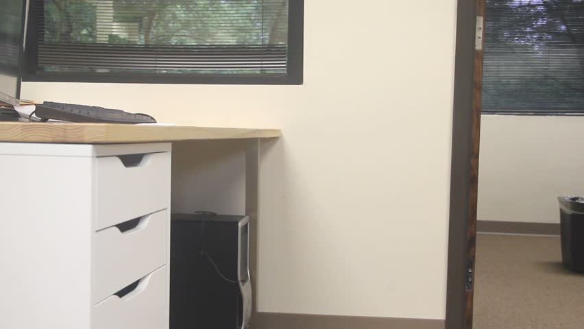 Empty Office Chair Rolled Up To Desk Twice