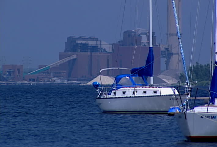 MUSKEGON LAKE - CIRCA 2008: Power plant near a harbor with boats on Muskegon Lake in Michigan circa 2008