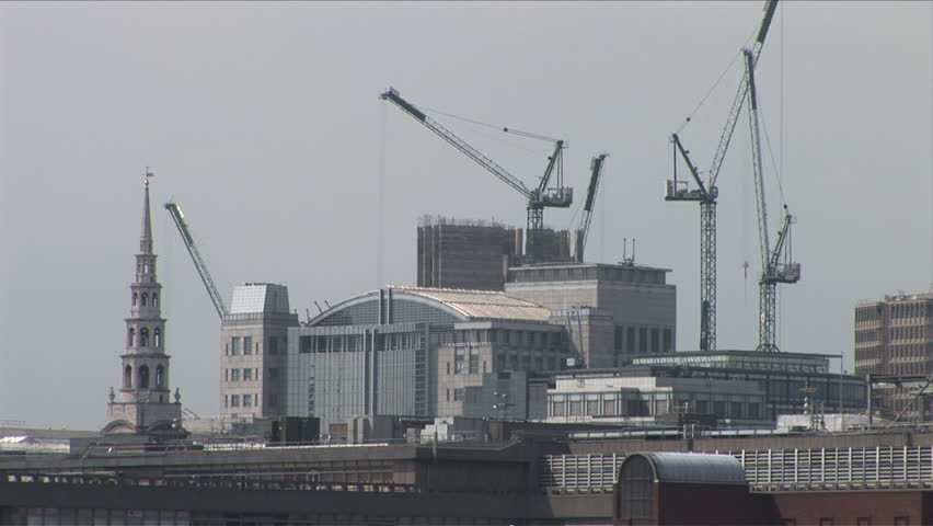 Long view of industrial cranes in London United Kingdom