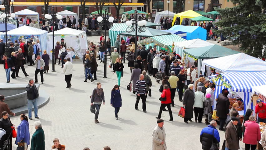 IVANO-FRANKIVSK, UKRAINE - APRIL 12: Crowd of people and trade tents at national traditional fair before Easter in city center on April 12, 2012 in Ukraine, Ivano-Frankivsk. Population city of 224 ths