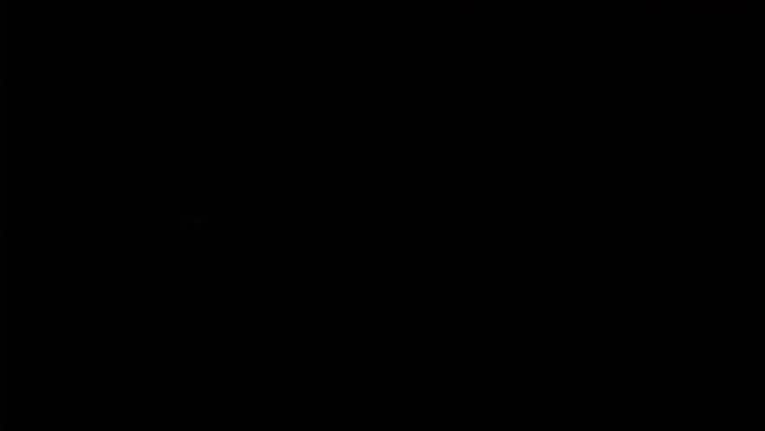 lighting a candle in dark close up