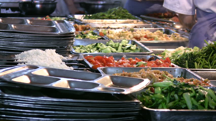 Preparing dishes for students in a school canteen in China