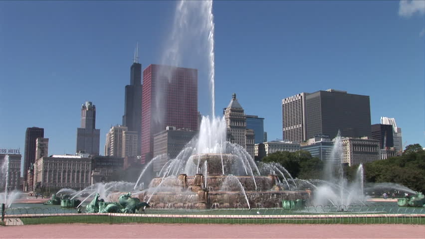 View of Buckingham Memorial Fountain flowing in the wind in Chicago United States