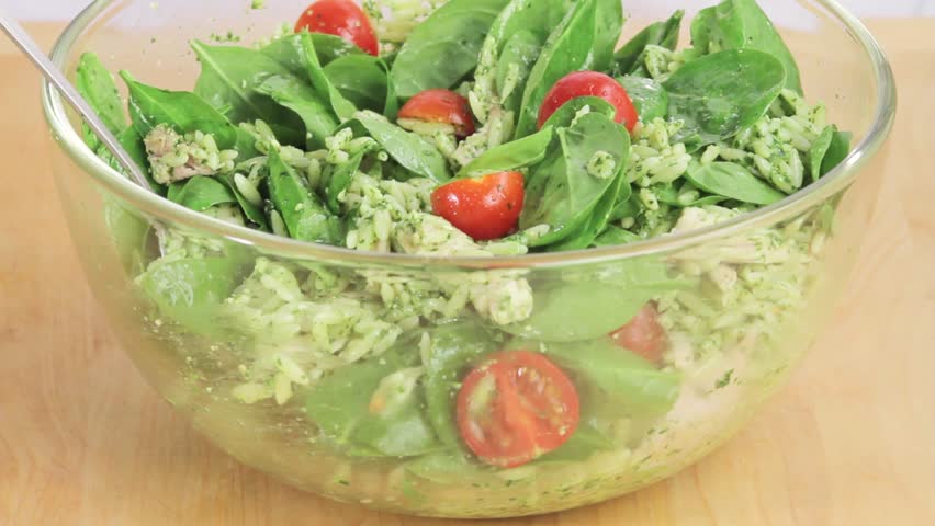 Chicken and orzo salad sprinkled with freshly grated Parmesan