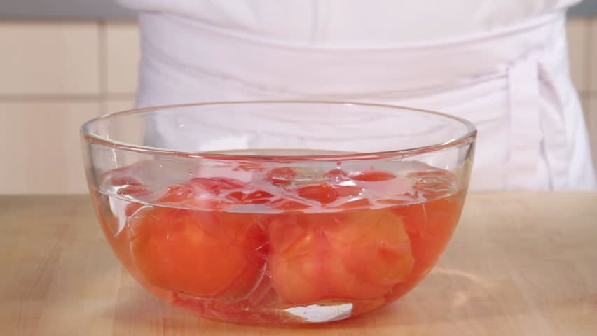 Skinning a blanched tomato