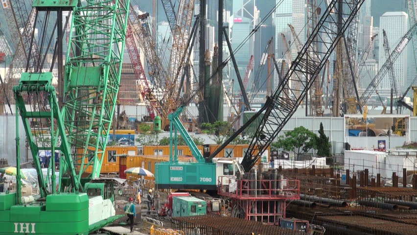 HONG KONG - 27 JULY 2010: A flurry of cranes 'obstructs' the view of the skyline of Hong Kong