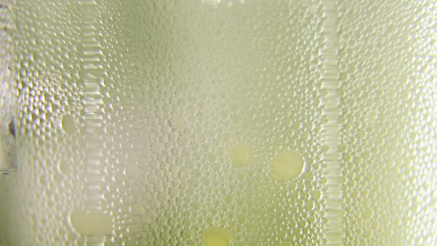 Macro clip of liquid, bubbles and froth. Abstract video that could be used as effect, transition or background and even as a conceptual video.
