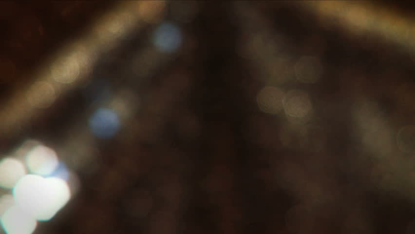 Close up image of beautiful blonde girls eyes made up with jewels