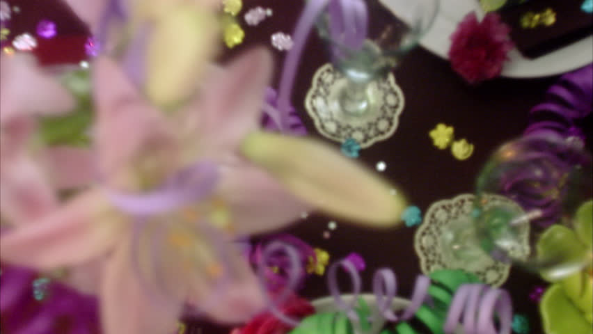 A table with confetti and streamers.