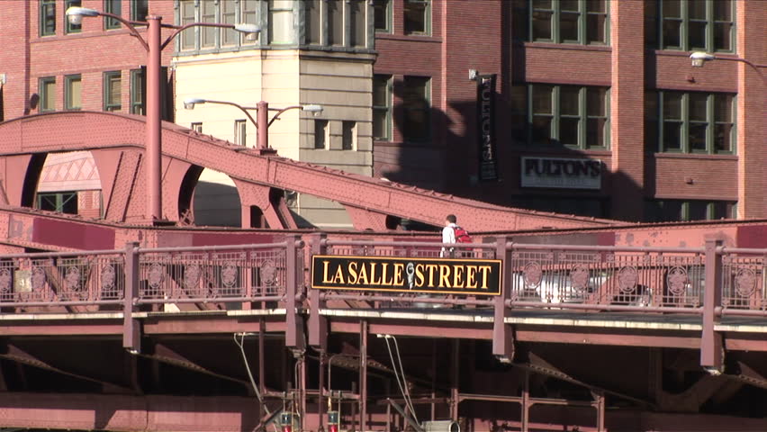Chicago, IL - CIRCA September 2007: Close up of people crossing the LaSalle Street bridge which spans the Chicago River during the day