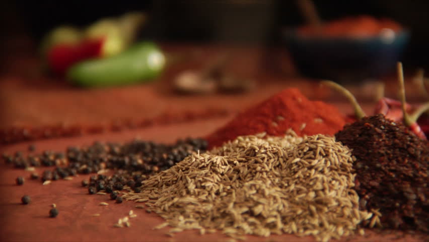 slow pan over peppers and a mountain of mexican spices