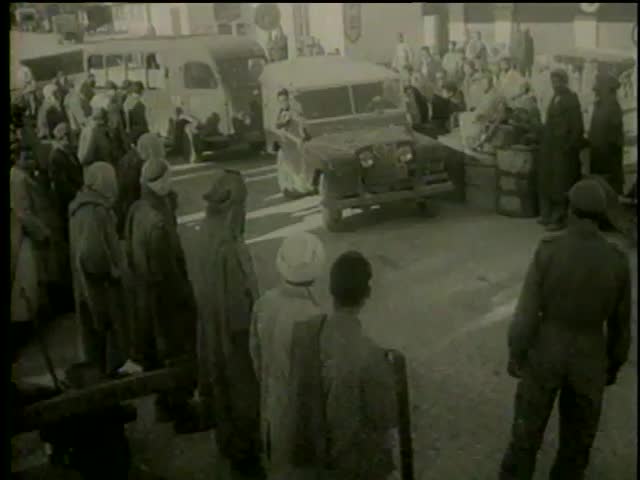 Blockade of french troops in Tunisia circa 1958. Cars and trucks is inspected and passed through Tunisian-Algerian border - MGM PICTURES, UNIVERSAL-INTERNATIONAL NEWSREEL, USA, filmed in 1958