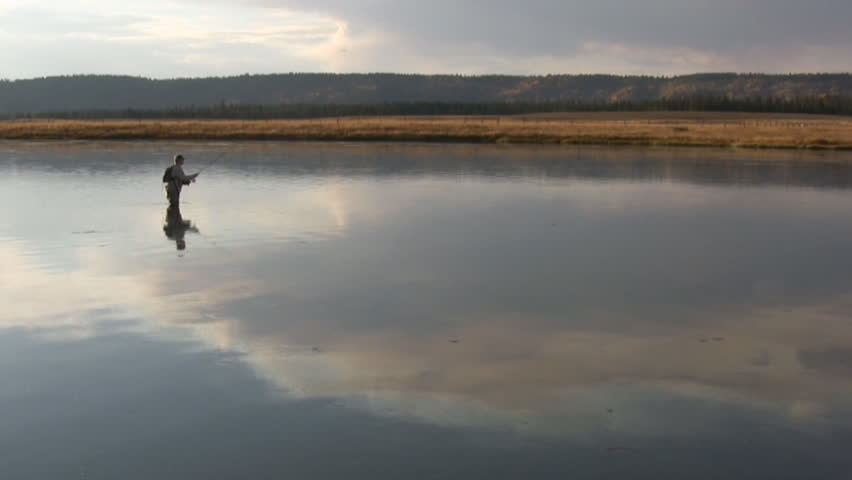 a angler casts to a trout at the Railroad Ranch section of the Henry's Fork River in Idaho