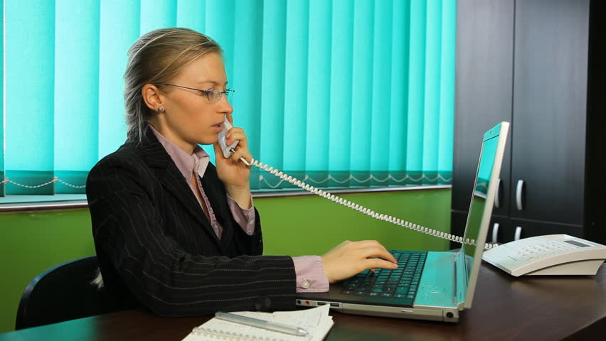A receptionist speak on phone