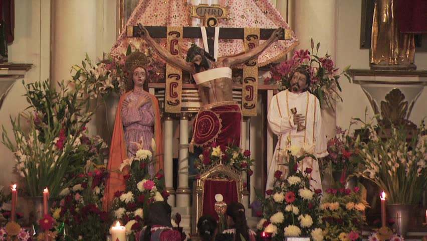 MEXICO - CIRCA 2010: Children Pray And Leave a Flower Offering At the Alter In A Catholic Church