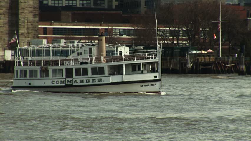 NEW YORK CITY, NY - CIRCA JUNE 2005: Small ferry Commander speeds through the East River