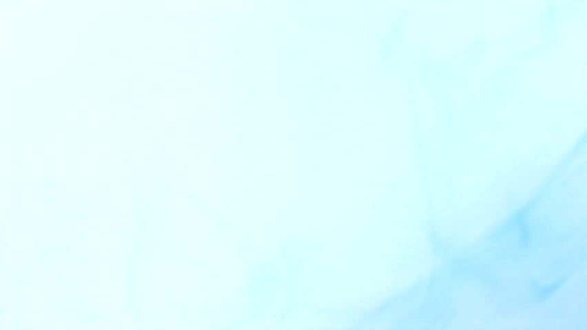 Blue food coloring floating in water against a light background