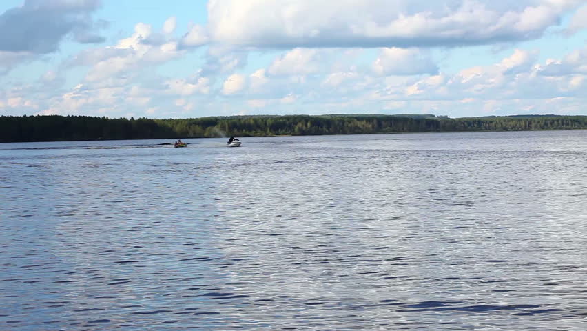 fast jet ski on lake in summer day